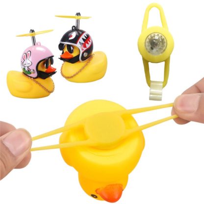 Желтая уточка-фонарик в шлеме на руль велосипеда